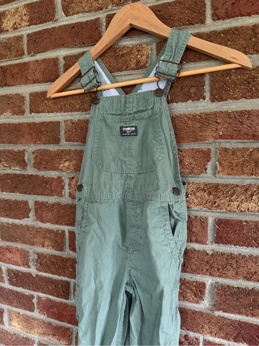 OshKosh B'gosh Kids Green Overalls. Airplanes on inside.  5T size.